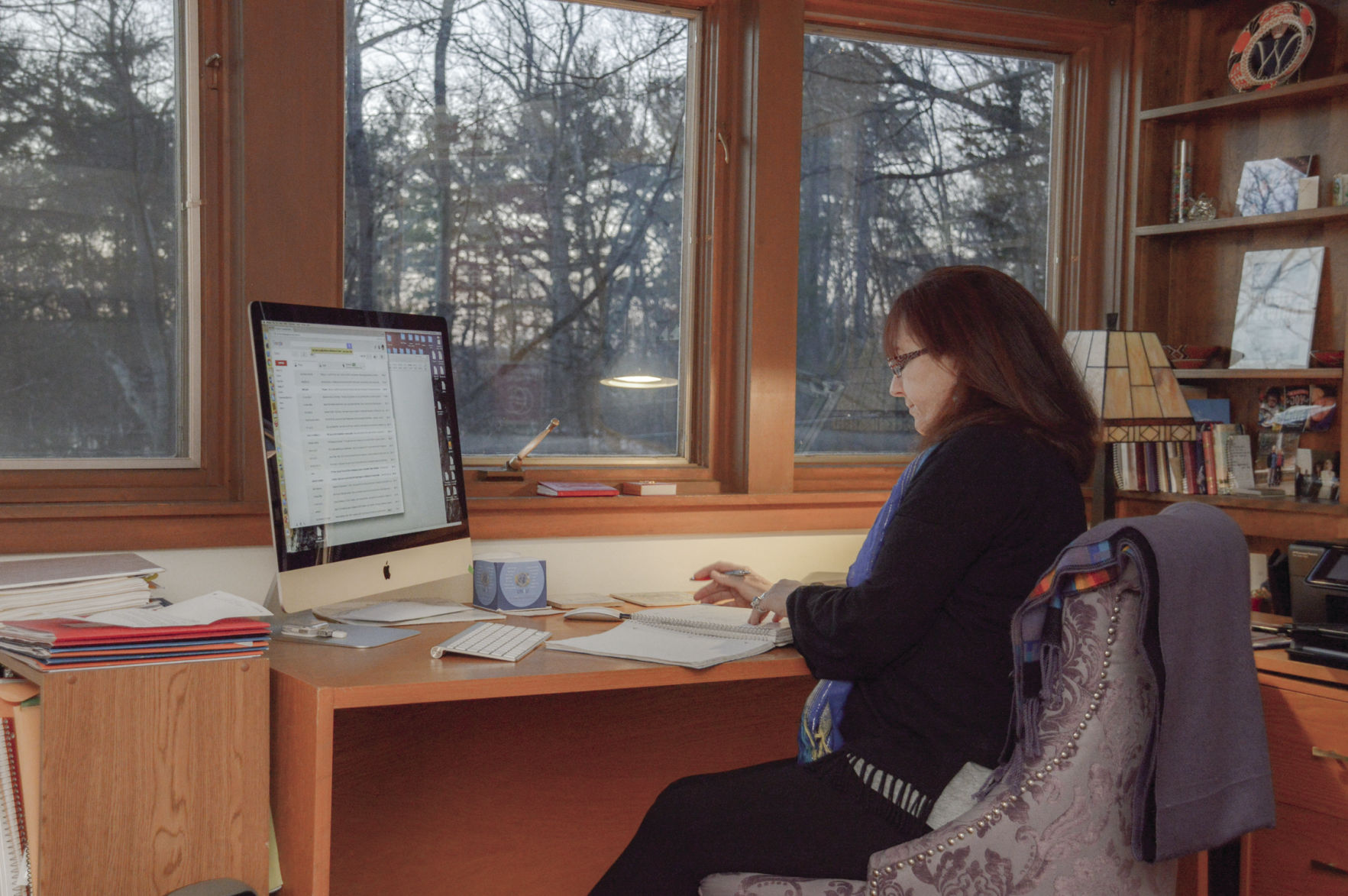 Gertrude Noden, Founder of Words Into Deeds at work in her home office recently.